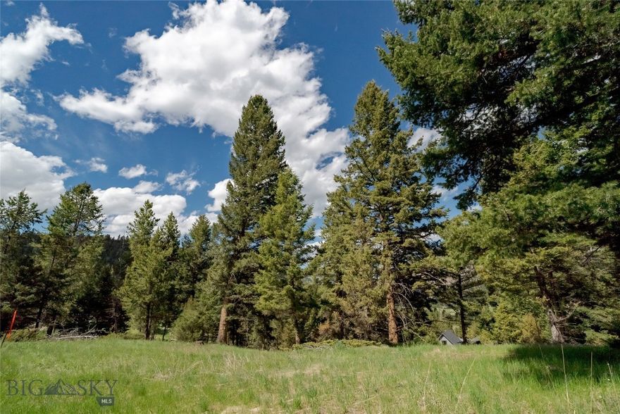 Located in the final phase of Gallatin Foothills, Lot 18 features sweeping views to the north and west, encompassing the rugged beauty of Levinsky Ridge. Adjacent to over 4 acres of open space, this lot offers both privacy and a level build site, making it an attractive option for designing and building a home amidst the natural landscape.  Gallatin Foothills neighborhood is situated on approximately 180 acres with mature trees and stunning mountain views, comprised of 1-2 acre lots featuring over 75 acres of open space, perfect for sledding and cross country skiing.  The neighborhood has a professionally built mountain biking and hiking trail weaving through the neighborhood, providing top quality on-site recreation. The Gallatin River is 3 minutes away, and Buck Ridge's trail network offers nearly 14 miles for four-wheeling and snowmobiling. Yellowstone National Park is only 13 miles south. Located near Big Sky’s Town Center, Big Sky Resort, and top schools, Gallatin Foothills also offers cultural experiences at the nearby Warren Miller Performing Arts Center. Don’t miss your chance to build your dream home. Schedule your tour of Gallatin Foothills Phase 2 today.
