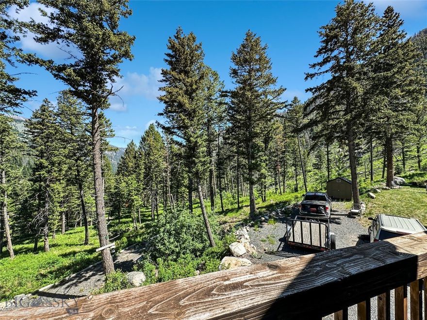 4 BED- 2 BATH cabin on TWO LOTS located in the trees close to National Forest Service and miles of back country trails for you to explore.  Be independent with your own well, septic, electric (yet has a propane generator if needed).  If you are ready to escape this chaotic world and find a perfect getaway high in the Tobacco Root Mountains then look no farther.    You could easily add a wood stove to add to your independent lifestyle.  Minutes from hunting in the National Forest. fish the South Boulder River or travel miles of trails to explore your back yard.  Be sure to bring your side by side or 4 wheeler.  This cabin is multi-level.  The open main floor has a nicely appointed kitchen with a dining table that looks out at the view.  2 bedrooms & a full bath are located on the main floor and there are an additional 2 bedrooms and bath in the daylighted walk-out basement.  The family room in the basement has a propane fireplace and the main floor has a pellet stove giving you different options for heat.  Want a bit more elbow room then hit the loft which could be a great office or TV room where you can enjoy the loft windows which let in a lot of natural light.  Most of the road is county maintained until "Upper Slope" road.  This cabin is offered with a second lot giving you future investment or building potential should you choose or just keep it for your solitude.  There are two outbuildings giving you the perfect option to store your toys.  Furniture could be purchased by private treaty making this your move in ready get-a-way just in time for summer.  In Montana you don't just buy a property.....you purchase a new lifestyle - choose yours today!!  Again......VA loan is assumable for qualified buyer (you do not have to be a Vet) at 2.625% interest but please understand this leaves a balance that you would need to either have cash or another source.  Call for details!