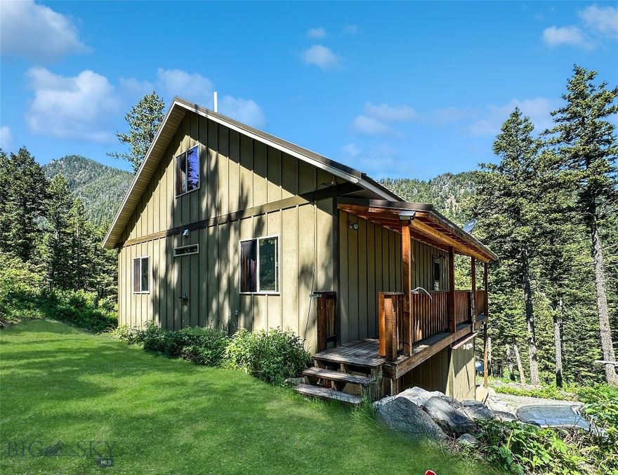 4 BED- 2 BATH home on TWO LOTS located in the trees with a 2.625% assumable loan AND it's own well, septic, electric (yet has a propane generator if needed) at MAMMOTH, MT.  If you are ready to escape this chaotic world and find a perfect getaway high in the Tobacco Root Mountains then look no farther.    You could easily add a wood stove to add to your independent lifestyle.  Minutes from hunting in the National Forest. fish the South Boulder River or travel miles of trails to explore your back yard.  Be sure to bring your side by side or 4 wheeler.  This cabin is multi-level.  The open main floor has a nicely appointed kitchen with a dining table that looks out at the view.  2 bedrooms & a full bath are located on the main floor and there are an additional 2 bedrooms and bath in the daylighted walk-out basement.  The family room in the basement has a propane fireplace and the main floor has a pellet stove giving you different options for heat.  Want a bit more elbow room then hit the loft which could be a great office or TV room where you can enjoy the loft windows which let in a lot of natural light.  The road can be challenging in the winter but that will protect your privacy even more!!  This cabin is offered with a second lot giving you future investment or building potential should you choose or just keep it for your solitude.  There are two outbuildings giving you the perfect option to store your toys.  In Montana you don't just buy a property.....you purchase a new lifestyle - choose yours today!!  Again......VA loan is assumable for qualified buyer (you do not have to be a Vet) at 2.625% interest.  Call for details!