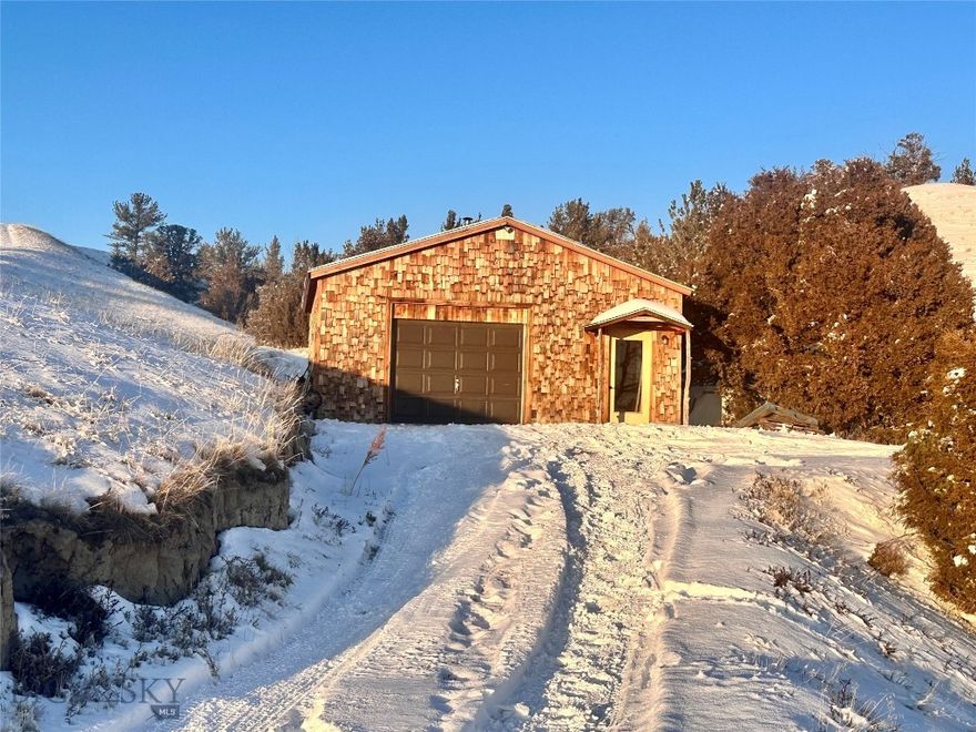 Beautiful 10 acre lot overlooking the Clarkston valley and Missouri River. Local lender FINANCING AVAILABLE as a land loan with 25% down. Lot is setup and ready to go! Improvements include POWER, an 18gpm WELL, and a 3 bedroom SEPTIC. There is a shop, build site, fire pit area, fenced animal area with shed and chicken coop, two additional sheds and a fenced garden area. A cute trailer, that would be great to live in while you build your Montana home, sits on the lot - or can be moved off.  A hip 1982 conversion Chevy school bus is also available or can be moved off. THE 1970 trailer is move-in ready and has a cozy wood stove and a new furnace in 2023. Make this your home, a rental, or live here and build your Montana dream home. Year round access. Near the school bus stop. This property is about 30 miles from Belgrade, only 35 miles to the airport and 40 miles to Bozeman. Ride horses, bikes, and ATVs right from home. The Clarkston community borders public land and the Missouri River, where you can trail ride your horse, let the dogs run and the kids play. Near Headwaters State Park, Copper City Bike Trails, and skiing at Bridger Bowl and Big Sky Sky Resort. Enjoy the Montana 'local' towns of Three Forks and Manhattan - where you will find restaurants, grocery stores, banks, health clinics, gyms, and a golf course. When you need 'a little bit more' - Bozeman offers anchor stores, a hospital, museums, art galleries, and upscale restaurants.