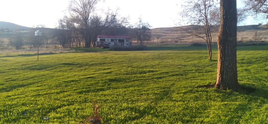 Never before on the market!  This beautiful piece of property has so much potential to add to what is already on site!  Create on off-grid homestead or retreat for family and friends.  This 9.56 Acre parcel hosts a small cabin, and two converted motorhomes that can be used for glamping or air bnb.   The views are amazing and the proximity to the lake, Glacier Park and more !