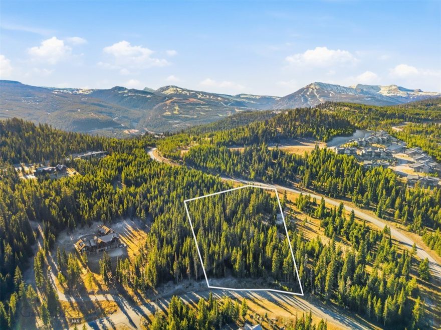 Set along Wilderness Ridge Trail, this Spanish Peaks Mountain Club homesite offers a quiet, wooded setting with the opportunity to open up northern-facing views toward the Spanish Peaks. Its location provides convenient access to club amenities and is just a short drive to Big Sky Town Center. Residents enjoy the Tom Weiskopf-designed golf course, Tom's Ten par 3 course, ski access to Big Sky Resort, multiple dining venues, Nordic skiing, mountain biking, a fitness facility, pool, and more. This is a perfect setting for your future Montana dream home. SP membership required with the purchase of this property.  A Golf membership is available with this Lot.