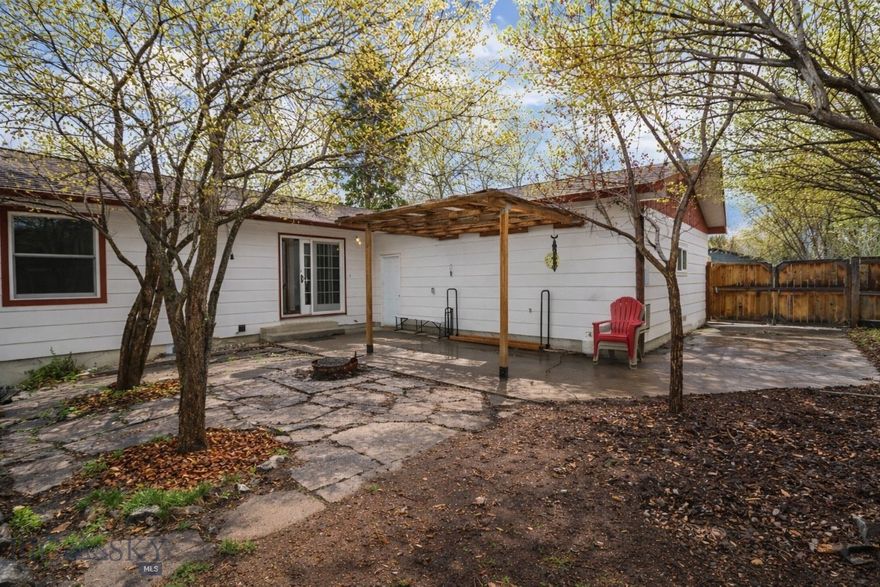 Nestled in a beautifully treed setting in the heart of Bozeman, this extensively updated 4* bedroom + office, 2.5-bath home offers 2,920 square feet of comfortable living space in an established neighborhood close to shopping, schools, parks, and everyday conveniences.

Thoughtfully improved over the years, the main level underwent significant updates in 2019, including a beautifully remodeled kitchen with oak cabinetry, newer appliances, tile backsplash & counter tops, wood flooring throughout, newer trim, solid wood interior doors, and updated Pella windows and exterior doors. The living room is anchored by a brick wood-burning fireplace, creating an inviting gathering space. A charming backyard patio off the dining area along with the front deck near the main entry creates seamless indoor-outdoor living.

Two of the bedrooms feature corner windows that bring in abundant natural light and enhance the home’s character. The fenced backyard offers mature trees, stone and rock landscaping, patio space, pergola, and play equipment, creating a wonderful setting for both entertaining and everyday living.

As of March 2026, the massive lower level has been completely renovated, adding beautifully refreshed living space and exceptional versatility. The family room offers ample room to create a 5th bedroom, office, or flex space, and a stunning 3/4 bath has been fully renovated with an attached original cedar sauna — comfortably sized for four.

With major capital improvements already completed—including newer windows, updated roof, remodeled main level, and fully refreshed lower level—this home offers the ideal blend of established neighborhood charm and modern updates.

*4th bedroom in lower level is non-egress.