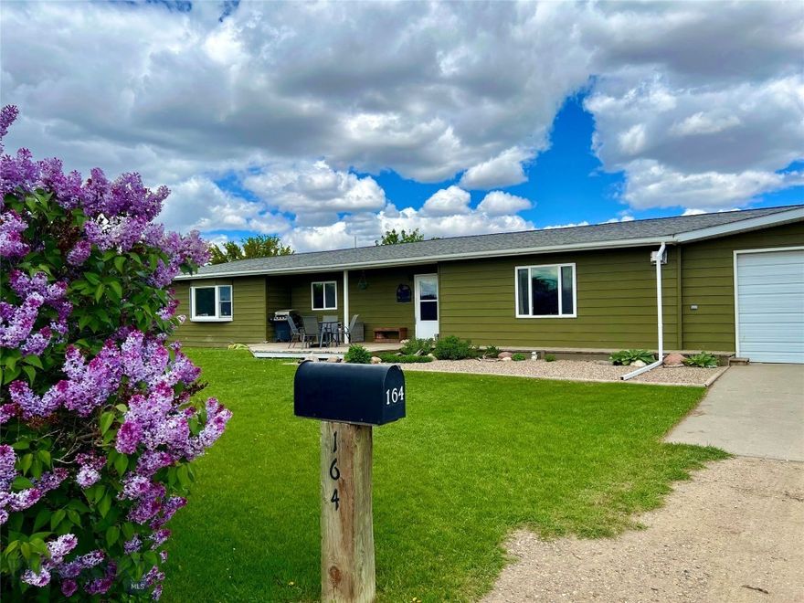 Nestled on 7.345 acres in the quiet community of Lothair, Montana, this unique property offers space, sustainability, and endless potential. Chemical-free for the past eight years, the land is thoughtfully set up for gardening with multiple established plots and the capacity to support a variety of animals, making it ideal for those seeking a self-sufficient lifestyle. The 2,640-square-foot home is well-maintained and updated, featuring four bedrooms, two full bathrooms, and two inviting living rooms—one upstairs and one downstairs—perfect for both gathering and relaxing. A gas fireplace adds warmth and charm, while the custom handmade kitchen island with shelving provides seating for up to 12, creating a true heart of the home. The spanning backyard is equipped with a sprinkler system, offering convenience and lush green space. Located in north-central Montana, recreational opportunities such as hunting, fishing, hiking, and exploring the wide-open prairies and nearby Sweet Grass Hills are all within reach. Less than 5 miles from the property is Willow Creek boat access to take advantage of fishing and playing on the water at Lake Elwell! Whether you envision a hobby farm, a family retreat, or a productive homestead, this property provides the flexibility to bring your vision to life.