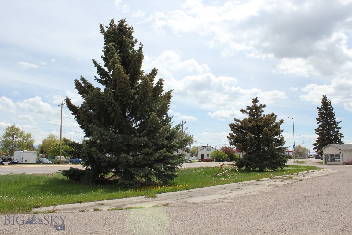 This property is located in a prime business area. This 1.21 acre property is surrounded by other successful business with direct access to Dillon's major thoroughfare. The business opportunities are endless. The property can be bought in it's entirety for $685,000 which includes the full lot and rental house, or the current owner would survey off the house and sell just the downsized bare lot for $450,000. The rental consists of two bedrooms and a bathroom on the main level. The basement level has it's own kitchen, two large rooms and 3/4 bathroom. The basement could be finished into a separate unit making for excellent rental income. If you are looking to build a business in Dillon, MT please check out this commercial property.