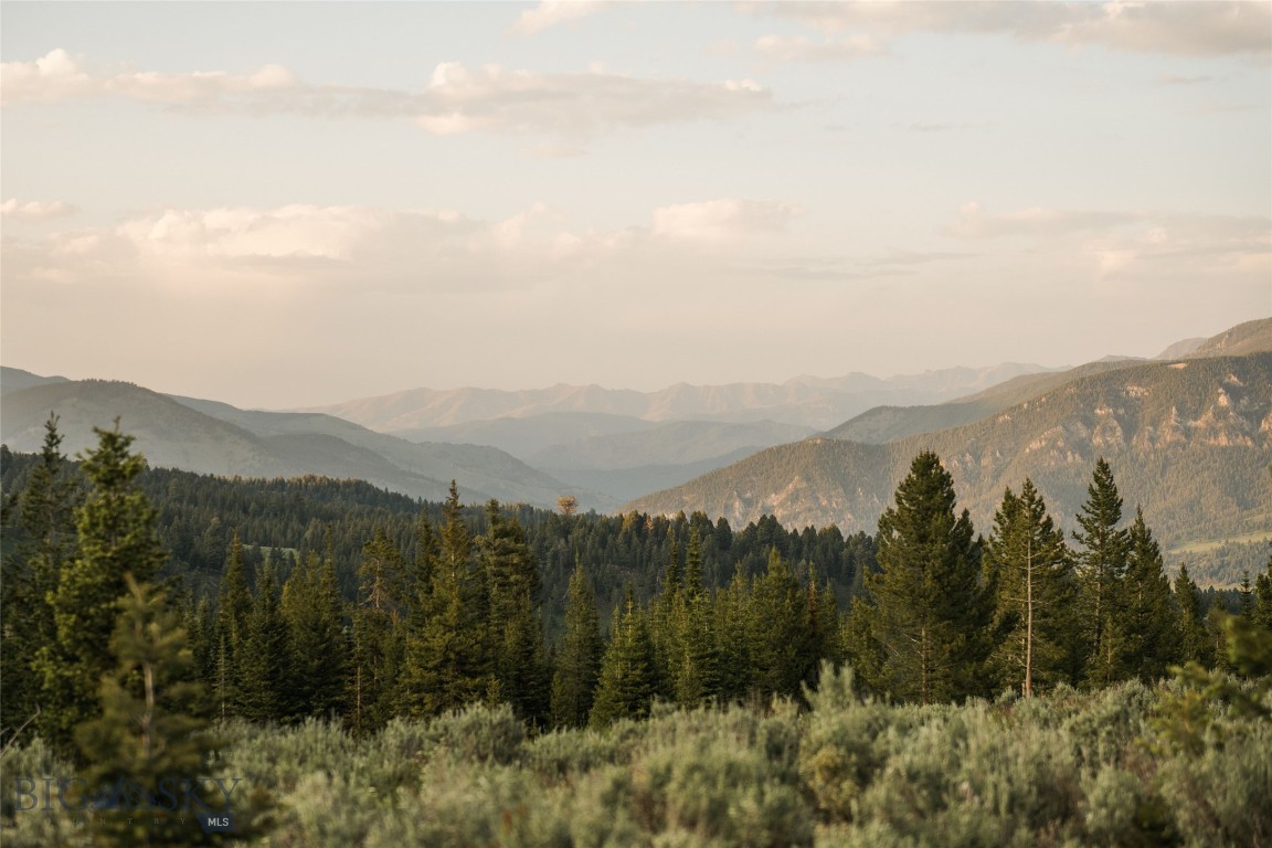 Exceptional 20-Acre Homesite in Big EZ – Iconic Views, Ultimate Privacy & Premier Club Access
Nestled within one of Big Sky’s most exclusive gated enclaves, this remarkable 20-acre parcel offers sweeping southern vistas, featuring dramatic mountain views that extend deep into Yellowstone National Park.
Situated in the prestigious Big EZ neighborhood, owners enjoy not only their own private acreage but also exclusive access to 160 acres of deeded open space, serene trout ponds, and a direct connection to the Gallatin National Forest, providing a private gateway to endless hiking, wildlife, and backcountry adventure.
The gently sloping topography invites the creation of a legacy mountain retreat, blending wide-open privacy with the sense of community found in this tightly held, high-caliber neighborhood.
Adding to the appeal, this parcel offers the rare opportunity to apply for a Charter Golf or Ski/Social Membership to the Spanish Peaks Mountain Club—subject to approval, deposit, and applicable dues and fees (membership must be secured prior to closing). This Club membership is independent from Big EZ HOA dues and opens the door to one of the most sought-after lifestyle offerings in the Rockies.
This unique blend of natural beauty, recreational access, gated security, and Club amenities makes this one of the most compelling homesite opportunities in all of Big Sky.
Photos feature the property itself, the scenic approach, nearby trout ponds, and the surrounding wilderness.
Listing Broker is a member of the ownership LLC.