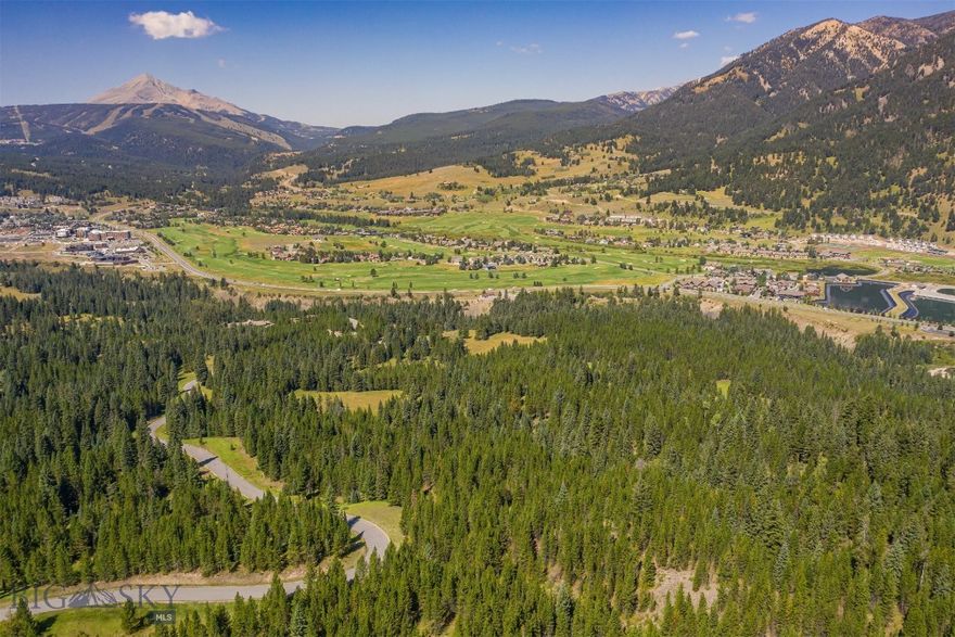 Undoubtedly one of the most beautiful lots in Skywood Preserve with huge head on views of Lone Mountain and the Spanish Peaks. This is the parcel with a pond and sunny meadow where all of the neighborhood bear, elk, moose and deer congregate to drink and play. 21 acres of privacy in a gated community with paved roads only 5 minutes to Meadow Village and Town Center and under 15 minutes to the ski slopes at Big Sky Resort and Moonlight Basin.  Walk to the South Fork of the Gallatin to wet a fly line and stalk a native cutthroat trout. Cross country ski or snowshoe without leaving your own property! Rolling benches covered with wildflowers and old growth pine trees provide several choices for private building sites for your home, guest house, shop or even a stable for up to two horses allowed seasonally. Elevation of the ideal building site on this parcel is 6,320 ft above sea level. SELLER FINANCING POSSIBLE.