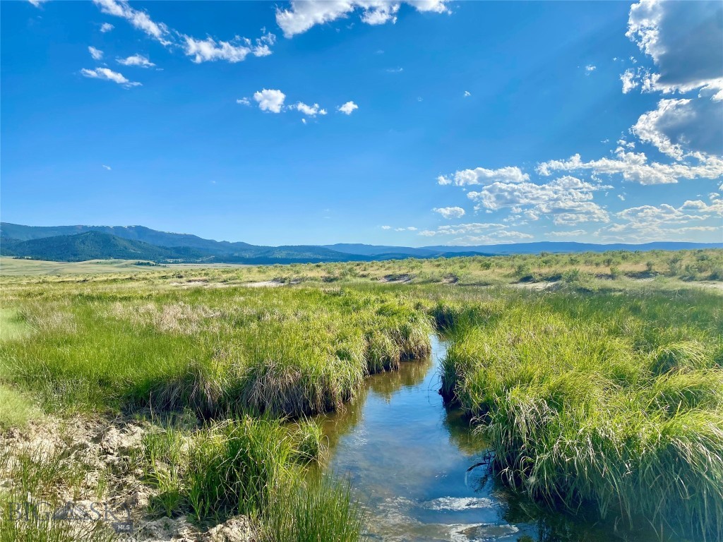 This property located in the heart of the Centennial Valley includes two parcels that are fully fenced and total 280 deeded acres of incredible pasture as well as an additional 80 acres of leased BLM. The surrounding views of the valley and the Centennial Mountains are breathtaking. There is ample water from two different sources – Jones Creek and Winslow Creek. Water rights are included. There is so much opportunity here. In addition to great grazing, this property would be an ideal spot for a hunting lodge. Or, the remote location would perfect to make it your own private and peaceful getaway where all you hear are the cows mooing and the birds singing . An existing grazing lease brings in a nice source of passive income, icing on the cake!