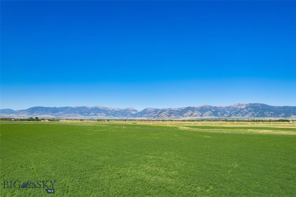 Flat 57.6 acres in the path of progress, located between Bozeman and Belgrade MT. This prime development property boasts outstanding Bridger Mountain views and easy access. Water rights and wheel lines convey. Currently planted in hay. McDonald Creek runs across the SE corner.