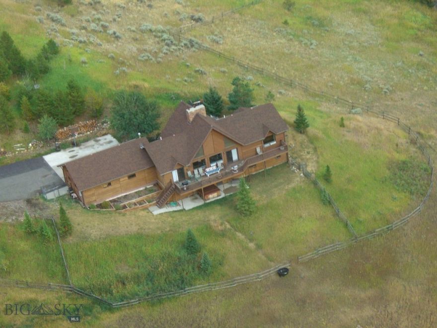 "High, Wide, and Hansome " ..in Bridger Canyon that means an elevated build site, panoramic views, and above and beyond comparison spectacular views of the Bridger Range and west to the distant Spanish Peaks. Truly this property is an opportunity not to be missed to purchase an iconic location in the very heart of Bridger Canyon. Included you will find a custom built home in good condition that features enduring cedar siding,a full walk out basement and upper level office nook. The classic floor plan features an entry foyer, vaulted great room ceiling, bedrooms on each level, a full walkout basement, computer office nook above, efficient mudroom exit to the garage,and incredible views of the main spine of the Bridger Range. Native landscaping adds a natural feel to the rolling countryside where elk and deer can be found at any season. The large outbuilding provides over 1,300 square feet of space for vehicle storage or horse shelter. 
   Move right in and live the dream or remodel/add on ,and create a true legacy home only minutes from Bozeman or the "Cold Smoke" of Bridger Bowl.