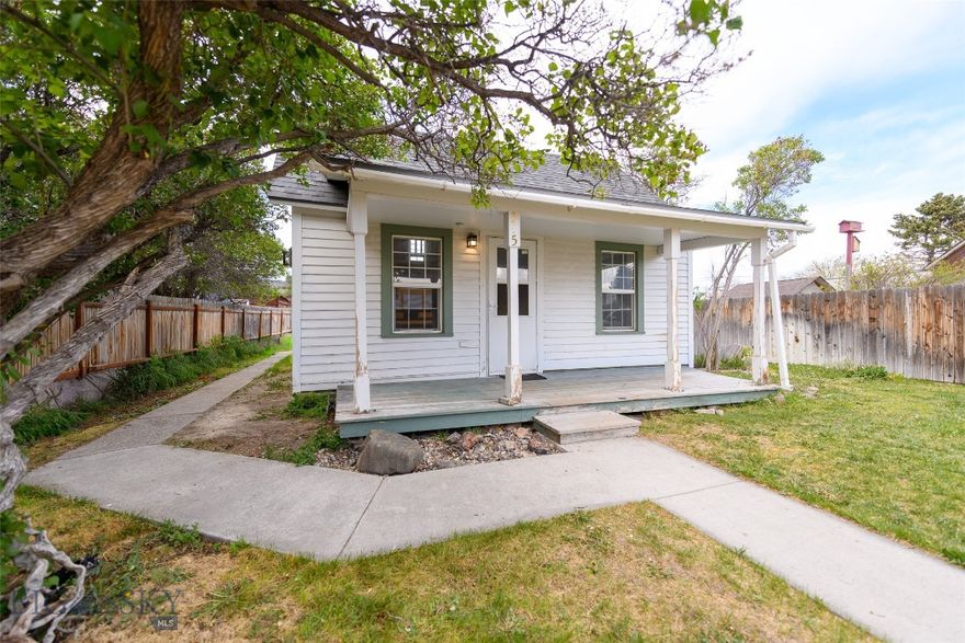 This inviting Dillon home offers affordability, functionality, and charm in a neat, quiet neighborhood. Situated on a spacious lot with mature trees, established shrubbery, and underground sprinklers, the property features a welcoming covered front porch along with 2 detached garages providing excellent storage or workspace potential. Inside, you'll find fresh interior paint, beautiful original wood flooring, vaulted ceilings that add warmth and character to the living space, and a brand-new gas stove. The home offers 2 bedrooms plus a versatile loft area that works well as additional sleeping space, office space, or bonus space. Exterior painting, caulking, and sealing improvements are currently being completed and will be finished prior to closing. Affordable homes with this much character, outdoor space, and flexibility are becoming increasingly difficult to find in Dillon.