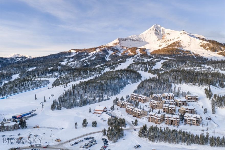 This expansive four-bedroom, four-bathroom top-floor condo is ideally positioned in one of Big Sky Resort’s premier ski-in/ski-out locations at the main base area. Located in the Beaverhead development, the residence sits just a few hundred yards from the new Big Sky gondola, offering unmatched access to the mountain.
The main level features sweeping views of the Spanish Peaks, Beehive Basin, and the Gallatin Range from the living and dining areas. The space includes a well-appointed kitchen, a new high-efficiency wood-burning fireplace, three bedrooms, and three full bathrooms—including a fully remodeled primary bathroom. Additional highlights include a laundry room, an indoor hot tub, and a covered balcony overlooking Andesite Mountain.
The upper level offers exceptional flexibility with an open loft and second family room, a large bunk room, a full bathroom, a new wet bar, and a spacious owner lock-off/storage room—ideal for gear, private storage, or future rental use.
Extensive upgrades have been completed throughout the condo, including all new windows and window treatments, upgraded kitchen lighting, a new oven and dishwasher, and a new elevator for the building. Each rear bedroom opens to its own covered deck, and the unit offers abundant storage throughout. A ground-level garage includes a massive ski and bike storage room/lock off closet with all new drywall.
Ski directly to and from the condo via the White Wing trail, placing this home among the very best ski-in/ski-out offerings at the Big Sky base area. While the condo has not been rented, it would make an exceptional short-term rental opportunity.
The condo is offered fully furnished, excluding only the seller’s personal photos and select décor items.