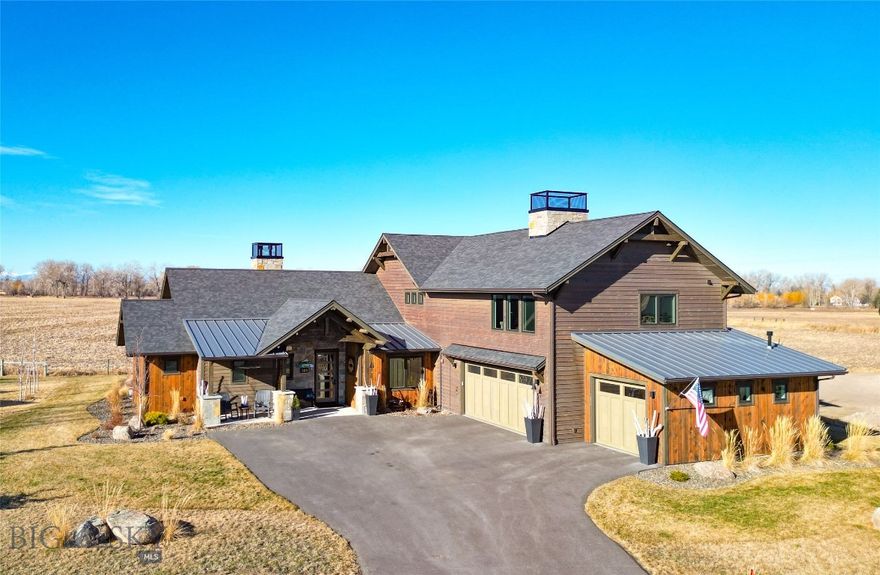 Experience privacy and some of the finest club amenities in the Black Bull Golf Club and Community in this luxury residence by ST Custom Homes. This 4-bedroom 3.5-bathroom home borders farmland offering unobstructed mountain views of the Gallatin Valley. The primary suite located on the main level has a spa inspired ensuite bathroom with heated floors, a deep soaking tub and massive shower with multiple heads.  Enjoy direct access to your back patio and gas fireplace via large sliding doors.  Soaring ceilings accented with reclaimed barnwood and a floor-to-ceiling tiled gas fireplace anchor the open-concept living space. The chef’s kitchen features a premium Thermador suite of appliances, modern integrated cabinetry, and sleek quartz surfaces, complemented by a dedicated wet bar and wine cooler for effortless entertaining. The two additional bedrooms connected by a Jack-and-Jill bath, a private home office, and a functional mudroom/laundry hub complete the main level. Upper Level offers a versatile bonus wing featuring a fitness space, a large media area, and a private guest suite with a full bath. The heated 3 car garage demands attention with 1,100 square feet, perfect for all your Montana toys. Attached to the garage is an exterior dog run with a dog door installed.
As a resident of Black Bull, you’ll have access to a world-class Tom Weiskopf-designed golf course, a private clubhouse, a fitness center, and a pool, all just minutes from the heart of Bozeman.