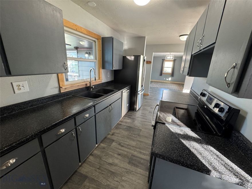 Well-maintained and move-in ready, this 4-bedroom, 2-bath home offers a functional layout, comfortable living spaces, and a location that makes everyday life easy. The main level features three bedrooms, a bright living room, and an open-concept flow through the kitchen and entry—ideal for both daily living and hosting. Enjoy the convenience of an updated bath with a custom walk-in tile shower.

Downstairs, you’ll find a spacious family room with an egress window, a fourth bedroom with an egress window, a second bathroom with a relaxing jetted tub, and a dedicated laundry area—perfect for guests, a home office, or additional living space.

Outside, the property continues to impress with a fenced backyard, an enclosed front yard, a welcoming front porch, and additional side access. A covered back deck creates the perfect spot for grilling and summer evenings. The detached two-car garage with alley access adds excellent storage and off-street parking convenience. A great combination of space, comfort, and usability—this one is a must-see.