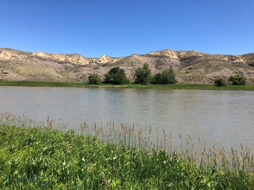 Missouri River frontage with fishing, boating, hunting, and power bordering BLM land across the river. Located between Highwood and Fort Benton, Montana. Land in Montana on the banks of the Missouri River isn’t easy to come by.  This is your chance to own Missouri River frontage out in the countryside of Montana. It bears repeating that this property has Missouri River frontage!! This amazing Montana property borders the Missouri River for over 300 feet and gives you 9.9 acres of land you could build your Montana cabin or home on. You’ll have the mighty Missouri River right out your front door to see, hear, and go fishing or boating on any time you want. The Missouri River is known for its trout, walleye, and pike fishing, as well as smallmouth bass, carp, catfish, and other species. By owning riverfront property, you’ll have easy access to the river to enjoy day in and day out. Just step out the front door of your cabin with your fishing pole in hand and take to the river for relaxation and fun as you catch the big ones in the waters of the Mighty Mo (Missouri). There are geese, ducks, and other waterfowl, as well as bald and golden eagles, that all use this stretch of the Missouri River for the valuable food and water it provides. The eagles can be seen gliding along the banks of the Missouri River, looking for food, or soaring along the bluffs on the opposite side of the river, making it seem so effortless to look down on everything from above. The deer and antelope in the area also use the river for the valuable water and nourishment it provides. That is evidenced by the trails you can see on the bluffs across the river on the BLM land there. You can watch them from the cabin on your property, and during hunting season, you can hunt that BLM land that borders your land just across the river. In fact, they’ll be within range during the general hunting season as they come down to the water at the river. Just wait and watch them from your picture windows. And if that’s not enough, the access road leading to the property goes through BLM land, which you can hunt and hike on, too. There are plenty of other BLM and State lands in the area, in addition to that, as well as block management areas that are open to hunting on private lands. The area is also well known for its fantastic pheasant and upland game bird hunting. You’ll see ring-necked pheasants and the other game birds just standing along the roads on the way to your Missouri River hideaway.