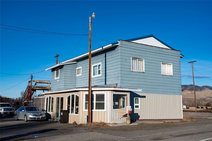 An exciting investment opportunity is available in the charming town of Cardwell, MT. Located close to Butte and less than an hour from Bozeman along I-90, this property features two units with tenants who are eager to stay. The upper level comes equipped with newer appliances, while the main level unit was completely remodeled in 2018, showcasing updated flooring and modern appliances. The upper unit also boasts a large deck with stunning views of the Tobacco Root Mountains towards Butte and Pipestone. Both units have separate electric meters, along with a third meter for the shared well; the owner bills neighboring properties for their respective shares of the electricity used for the well. A large pellet stove efficiently heats both units. Additionally, there is a common area with an additional bathroom. Included with the property is a detached two-car garage with an opener, as well as a 20x22 shop. The landscape is enhanced by fruit trees and perennial plants. Don’t miss out!