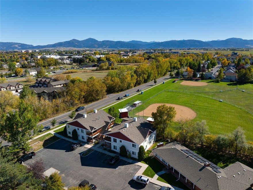 Bright and inviting describes this top-floor condo in the Tradewinds Condominiums, offering a fantastic opportunity to live or invest in one of Bozeman’s most convenient locations. This exceptionally clean 2-bedroom, 1-bathroom condo features an open floor plan with updated flooring throughout (no carpet!) A spacious covered deck adds ideal space that's perfect for relaxing or entertaining. Enjoy the abundant natural light, efficient layout, and a central location close to shopping, restaurants, trails, and MSU. The condo includes two dedicated parking spaces, offering rare convenience for this area. Whether you’re looking for a low-maintenance home or a solid rental investment, this Tradewinds condo delivers location, livability, and value all-in-one.