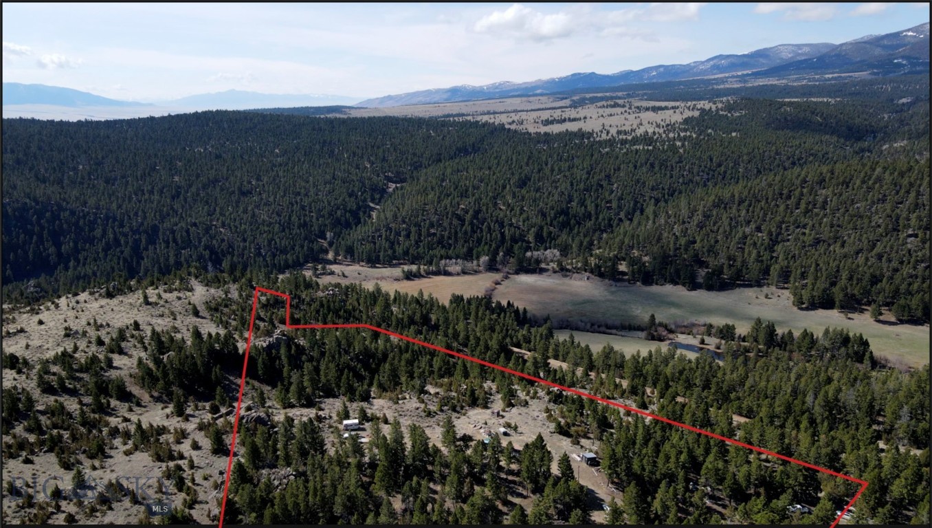 10.2 acres with unbelievable views! This property can be accessed year round if road is kept up by owner. There used to be power but at some point Northwestern Energy took the line down but the pole is still there. There are a few outbuildings and a partially converted container that the seller uses as a hunting shack. The seller is slowly working to remove personal property. There may be a well and septic but seller has no information on either.