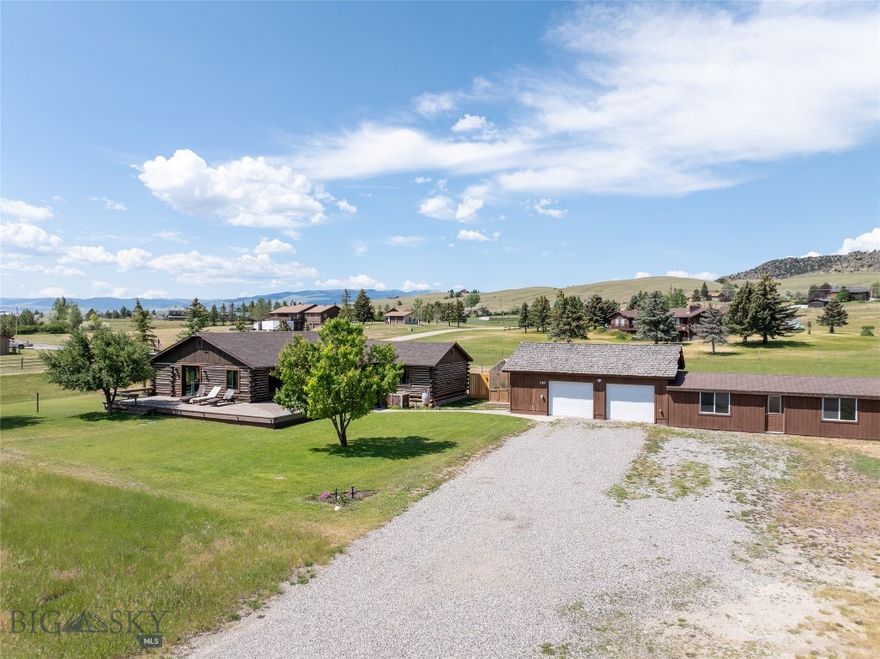 107 Antelope Meadows is a well-cared-for log home situated on 2.88 acres on a quiet street above Ennis, Montana, offering expansive views of the Madison Range and distant Ennis Lake. Over the years, the property has received consistent maintenance and thoughtful upgrades—including a new roof, updated windows, remodeled bathrooms, new flooring, a fully updated kitchen, fresh paint, and exterior upkeep.
This 4-bedroom, 2-bathroom home spans approximately 1,994 square feet and blends the warmth of a log cabin with bright, sunny interior spaces. The large primary suite opens directly to the deck, includes a walk-in closet, and provides a comfortable retreat. Enjoy both covered and open decks throughout the day—whether you prefer sun or shade.
The detached two-car garage features an electric-heated workshop with concrete floors and two additional storage areas. The home also offers central AC,  new furnace in 2025, underground sprinklers, a greenhouse, and mature landscaping that enhances the sense of permanence and personality.
Ideal for those with animals, the property is partially fenced with secure dog space and fenced pasture. Chickens are allowed. A leased 1,000-gallon above-ground propane tank (usage is approx. 1000 gallons/year) supports the home.
If you’re seeking a single-level home with character, in a special location with mild covenants—just minutes from downtown Ennis and K–12 schools—this property deserves consideration. No active HOA, but owner pays a voluntary fee of $200/year for road maintenance.