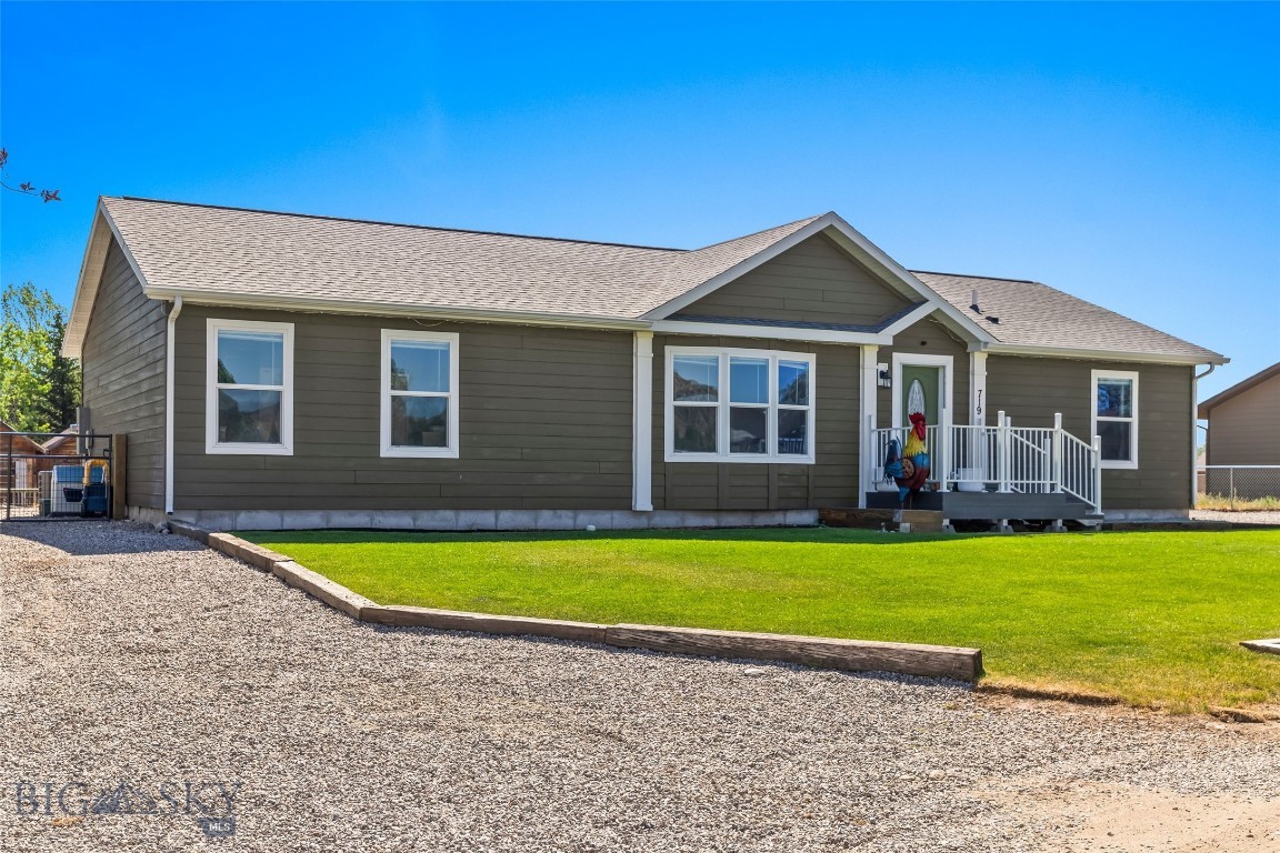 This well-appointed 2020 modular home offers the perfect blend of comfort, convenience, and Montana charm all located in the heart of Ennis. With 1,680 sq ft of thoughtfully designed living space, this 3 bedroom, 2 bathroom home sits on a concrete 4-foot crawl space and features numerous upgrades throughout. Step inside to a bright, open living area with vaulted ceilings, a spacious kitchen with a large walk-in pantry, farm sink, and upgraded finishes, ideal for entertaining or everyday life. The spacious primary suite is a true retreat, featuring a dual vanity, luxurious soaker tub, tile walk-in shower, and a sliding barn door that opens to a generous walk-in closet. Two additional guest bedrooms share a full bathroom, offering comfortable accommodations for family or visitors. You'll also appreciate the well-designed laundry/mud room which is perfect for storage, gear, or coming in from your next adventure. The home is equipped with propane forced-air heat and central air conditioning, keeping you comfortable year-round. Outside, enjoy a fully landscaped yard with additional gravel parking, perfect for your camper, boat, or recreational toys. A private well on the property may also be used for irrigation.
Conveniently located just blocks from Ennis School, Main Street shops, restaurants, and other local amenities, this property offers small-town living at its finest. Ennis is a hub for outdoor adventure, just minutes from world-class fly fishing on the Madison River, hiking and hunting in the surrounding mountains, and a short drive to Yellowstone National Park or Bozeman. Whether you're looking for a full-time residence or a getaway with easy access to Montana's best recreation, this move-in ready home checks all the boxes.