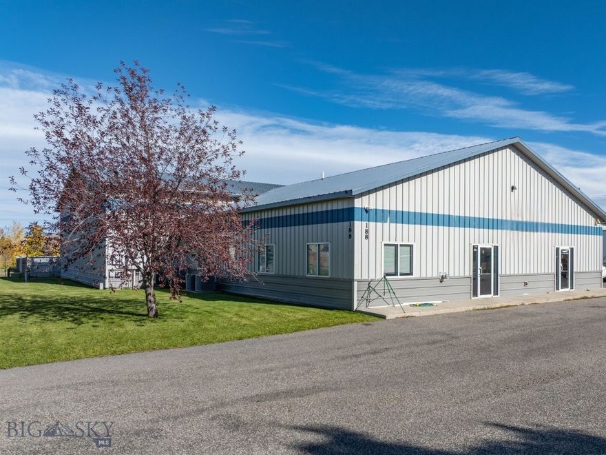 Built for durability and performance, this 18,500± SF metal-clad warehouse in Four Corners offers exceptional commercial functionality and a layout suited to both heavy operational use and customer-facing business. The building features two expansive warehouse bays measuring 144' x 60' and 100' x 70', each with 16'+ ceilings that accommodate efficient racking, equipment maneuverability, or large-scale production. A separate space ideal for a retail setup enhances versatility and provides a valuable opportunity for direct customer interaction.

Supporting spaces include two private offices, a breakroom, a print/storage room, and three bathrooms, creating a comfortable and well-organized work environment. The property is equipped with 220V power, fire suppression, and is connected to Four Corners water and sewer, adding reliability and essential infrastructure.

Exterior access is exceptional, with four overhead doors—three 12' x 10' and one 12' x 20'—plus a loading dock for streamlined logistics and deliveries. The durable metal siding and metal roof ensure long-term, low-maintenance performance.

In addition to the warehouse, a fenced lot measuring approximately 1.06 acres is also available for lease at $3770/month. This space is ideal for outdoor storage, equipment parking, or additional yard capacity to support expanding operations.

Located within commercial zoning and positioned for easy access to Bozeman, Belgrade, and Big Sky, this stand-alone warehouse provides a rare combination of size, flexibility, and high-demand location within the Gallatin Valley.