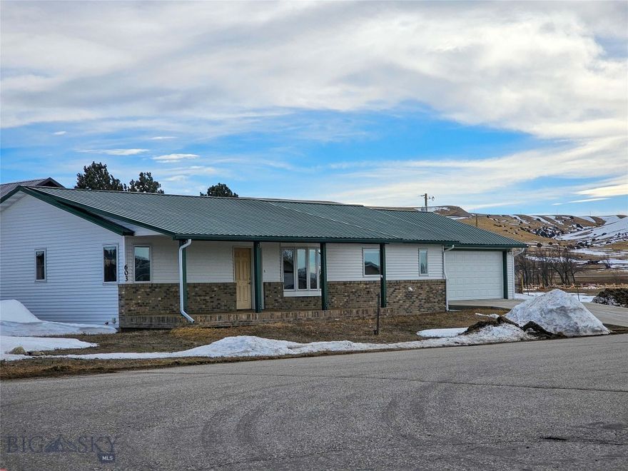 A spectacular 3,120 sq. ft. home on a great corner lot on the west side of Big Timber. The home is a single level main living area, with a full basement. Although the basement is unfinished, the upstairs provides comfortable living space. There is a primary bedroom with en-suite bathroom and walk in closet. The kitchen, living room, and dining room area is well thought out, spacious, and very comfortable. On the other side of the home, lies two bedrooms and a full bathroom. A mudroom with washer/dryer hookups and a half bath lead to the oversized two car garage that leaves plenty of room for additional work space. Come take a look at this great home in the “best last place.”