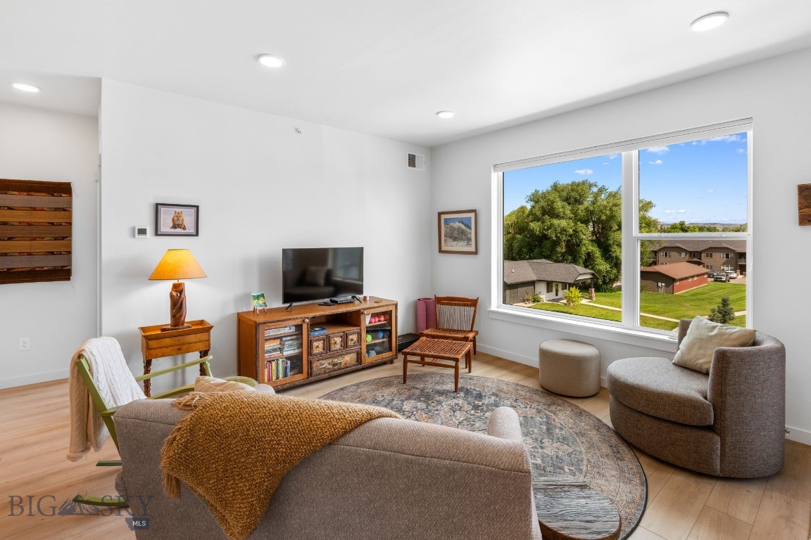 Welcome to this immaculate, top floor, 3 bedroom condo in the heart of Livingston, Montana, offering a perfect blend of modern comfort, functionality, and location. Light, bright and beautifully maintained, this unit features a thoughtfully designed layout with quality finishes and details throughout. Enjoy a spacious open concept living area with abundant natural light. The kitchen is equipped with modern appliances, sleek cabinetry, and a large island- ideal for entertaining or casual meals. Step outside to your private covered balcony- perfect for enjoying your morning coffee or unwinding in the evenings. The primary suite includes a walk-in closet and a well-appointed ensuite bathroom, while two additional bedrooms offer space for guests, a home office, or hobbies. A detached garage provides convenience, extra storage, and protection from the elements year-round. This quiet, well-maintained building is located near Livingston's many trails, parks, schools, shopping, and limitless recreation opportunities. Situated a short ways away from Yellowstone National Park's northern entrance, the town of Livingston has earned national acclaim for its stunning mountain vistas, eclectic downtown area, and prime location near Montana's most iconic outdoor activities.