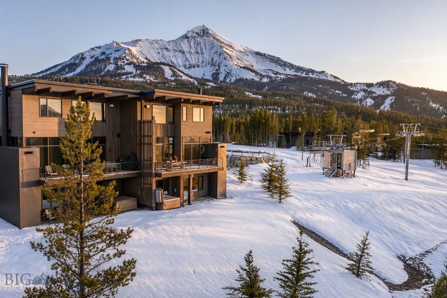 Located in the coveted slopeside community of Moonlight Basin, this lakeview end unit residence offers a rare convergence of position, outlook, and access in one of Big Sky's most prestigious neighborhoods. Expansive windows frame sweeping views of Lone Peak, the Madison Range, and the Spanish Peaks, flooding two generous living spaces and an open, thoughtfully composed floor plan with natural light and alpine drama throughout.
Five bedrooms and a mountain modern interior finished with great attention to detail reflect a fusion of contemporary sensibility and enduring mountain character. As an end unit, the residence enjoys enhanced privacy and an elevated sense of openness that sets it apart within the collection.

Ski-in, ski-out access via Jayhawk lift and Dodgeball ski trail connects the home directly to the world-class terrain of Big Sky Resort, with the added ease of stepping from the mudroom onto the mountain. Ulery's Lake sits just steps away, offering kayaking, paddleboarding, fly fishing, hiking/biking/nordic trail system, and year-round recreation through Moonlight Outfitters.

Ownership provides the opportunity for Moonlight Basin Club membership, extending the lifestyle well beyond the residence with access to an 18-hole Jack Nicklaus Signature Golf Course, the slopeside Moonlight Lodge, the vibrant LakeLodge, Ulery's Lake Camp, and miles of private hiking, biking, and Nordic trails. Just moments away, the acclaimed One&Only Moonlight Basin Resort offers exceptional dining, world-class spa experiences, and refined alpine hospitality that further elevates daily life in the community.

Few places offer this particular rhythm with mornings on the mountain, afternoons on the lake, and evenings under a sky that belongs entirely to you.