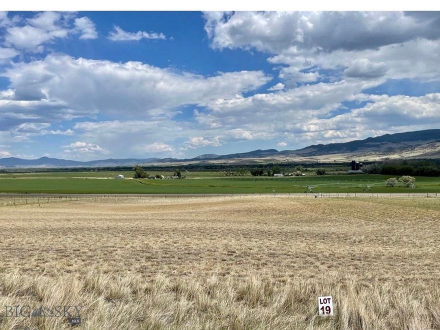 HARD TO FIND BUILDING LOT OFFERING EXPANSIVE FARMLAND AND TOBACCO ROOT MOUNTAIN VIEWS THAT CAPTURE THE TRUE MONTANA EXPERIENCE. Most land parcels you find in Montana are down a long gravel road or way out of town. This property is in a subdivision near town elevated just enough to look over the valley and take in the Big Sky rocky mountain views! This gently sloped 2.55 acre parcel is positioned just off Highway 55, approximately 5 miles from downtown Whitehall, with efficient access to I-90 for travel to Butte, Bozeman, or Helena. Located within Jefferson Acres Subdivision, the surrounding area includes quality newer construction homes recently completed or currently under construction, creating a growing neighborhood that maintains a rural, open feel. Electricity to the lot, making it well suited for a primary residence, recreational retreat, or long-term investment. A standout feature of this property is its proximity ~306 acres of Montana State Land bordering the back of the subdivision, providing immediate access to wide open space for hiking, horseback riding. The Whitehall area is known for outdoor recreation.The nearby Tobacco Root Mountains offer an extensive network of trails and backcountry access for hiking, trail riding, and high-country adventures with panoramic views, alpine lakes, and diverse terrain. The Jefferson River, one of the headwaters of the Missouri River, is a centerpiece of the valley and only minutes away, with the popular Waterloo Bridge fishing/floating access about a 5 minute drive from the property.This stretch of river is well regarded for brown and rainbow trout fishing, as well as floating, kayaking, paddleboarding, and summer days on the water. The surrounding Jefferson Valley is highly sought after for hunting, with abundant populations of elk, mule deer, whitetail deer, and antelope supported by agricultural fields, river bottoms, foothills, and nearby public lands. Whitehall is rich in Montana history, located along the route traveled by the Lewis and Clark Expedition in 1805 and surrounded by landmarks tied to early mining, railroad development, ranching, and settlement of the region, including nearby Lewis and Clark Caverns State Park. Despite the peaceful rural setting, this location remains central and accessible, approximately 60 miles to Bozeman, ~55 miles to Helena, ~30 minutes to Butte, offering scenic beauty, recreation, public land access, and historic Montana character. NOTE ONLY 13 MINUTES TO PIPESTONE!