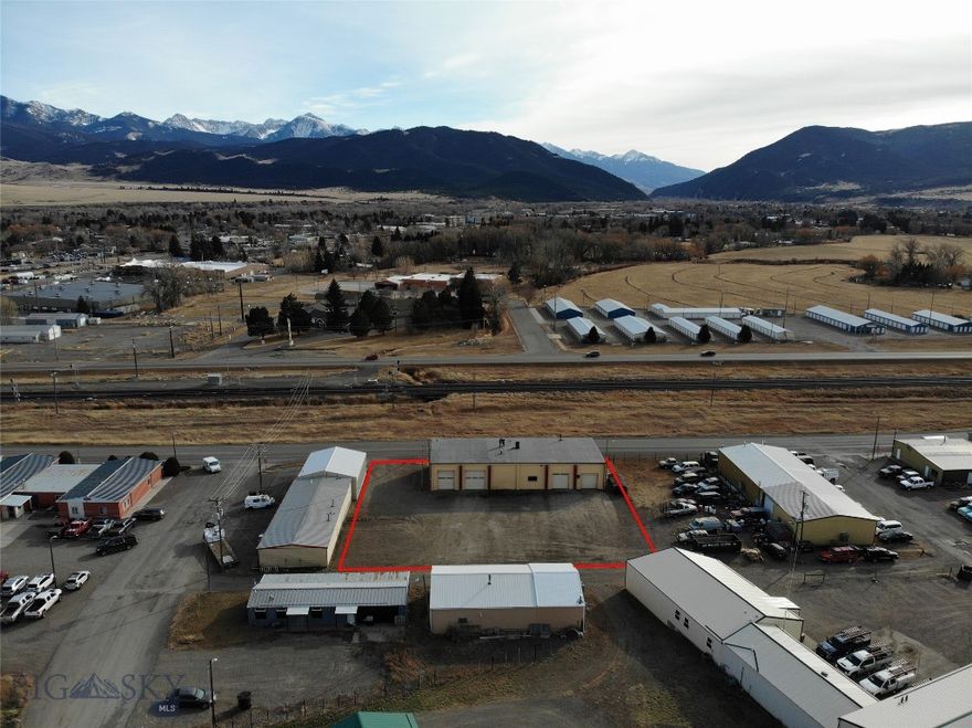 This is a great opportunity to purchase an extremely well-built duplex industrial warehouse building in one of the few industrial zone areas of Livingston. The McLaughlin Building consists of (2) 2000 sqft units, both with 16 ft tall ceilings. Most of the interior walls are modular and not attached to the ceiling. Steel concrete encased I-beams span the building’s interior and support a rebar reinforced concrete roof. The roof is covered by a 12-year-old, 30 year warranted rubberized membrane. The building is equipped with three-phase electricity, wood burning stoves, gas furnaces and electric baseboard heaters.  The bathrooms in each unit have been fully remodeled. This turnkey building is tenant ready or awaits the imagination of a new owner. The property has enough room to accommodate parking for 20 vehicles, building expansion or possible construction of another building. Zoning for the area allows 37 different uses. The building’s location on Front Street makes it an exceptional location for a new or expanding business. Front Street services several subdivisions and is a high traffic arterial street. Building functionality, property location and a reduced sale price are all the ingredients needed for creating a great opportunity.