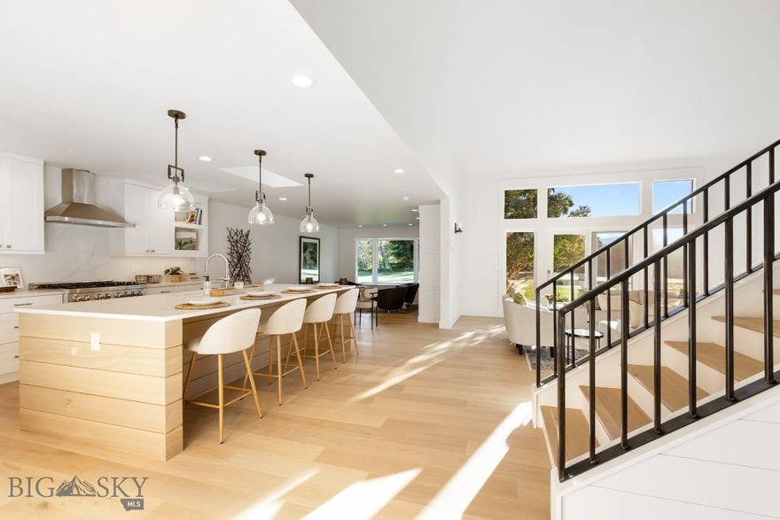 Welcome to 2510 Fairway Drive — where South Bozeman sophistication meets effortless Montana living. Perfectly situated on a quiet cul-de-sac overlooking the lush 18th tee of Valley View Golf Course, this fully reimagined Montana Farmhouse–style condo is a rare offering in one of Bozeman’s most sought-after neighborhoods. Here, serenity meets accessibility — enjoy sweeping golf course and mountain views from your private patio, while being just minutes from Main Street, MSU, the Museum of the Rockies, Pete’s Hill, Bobcat Stadium, and the Sourdough Trail.

Every inch of this 2,769 sq. ft. residence has been masterfully renovated to the highest standard. White oak floors, solid quartz surfaces, ZLINE professional appliances, and a custom steel staircase speak to the home’s elevated design. Thoughtful details abound — designer lighting and wallpaper accents, custom cabinetry, a stunning leathered marble primary bath with heated floors and a freestanding soaking tub, wool carpeting in guest suites, and a heated, finished two-car garage with epoxy floors and ample attic storage space.

The main level is designed for refined, everyday living: a vaulted great room that opens seamlessly to the patio, a chef’s kitchen adjoining a cozy dining/library space with fireplace, a private office, powder bath, and a luxurious primary suite. The suite features dual closets, a double vanity, a spacious glass shower, and a freestanding tub — a tranquil retreat after a day in the Montana outdoors. Upstairs, two generous guest bedrooms and a full tiled bath offer privacy and comfort, including one suite with its own balcony overlooking the fairway.

Perfectly suited for full-time living or as a lock-and-leave residence, this home blends convenience and sophistication — the HOA handles snow removal and landscaping, allowing you to simply enjoy your surroundings year-round or travel worry-free.

Residences of this caliber in this location are exceptionally rare. For those seeking timeless design, modern luxury, and a premier Southside address — 2510 Fairway Drive stands in a class of its own.