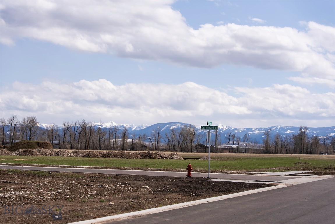 Discover the perfect canvas for your dream home on Bozeman's coveted west side! This picturesque parcel, just over half an acre, boasts sweeping panoramic views of the Gallatin, Madison, and Bridger Ranges. Experience nature's beauty year-round with this stunning backdrop, offering an ever-changing display of Montana's finest landscapes. Conveniently located, this lot provides easy access to Big Sky's world-class recreation—from skiing and snowboarding in winter to hiking and mountain biking in summer. Just minutes from Bozeman's vibrant downtown, you'll enjoy an array of shopping, dining, and entertainment options close to home. Don't miss this rare opportunity to build your own slice of Montana paradise!