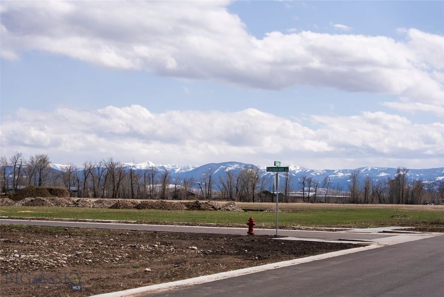 Discover the perfect canvas for your dream home on Bozeman's coveted west side! This picturesque parcel, just over half an acre, boasts sweeping panoramic views of the Gallatin, Madison, and Bridger Ranges. Experience nature's beauty year-round with this stunning backdrop, offering an ever-changing display of Montana's finest landscapes. Conveniently located, this lot provides easy access to Big Sky's world-class recreation—from skiing and snowboarding in winter to hiking and mountain biking in summer. Just minutes from Bozeman's vibrant downtown, you'll enjoy an array of shopping, dining, and entertainment options close to home. Don't miss this rare opportunity to build your own slice of Montana paradise!