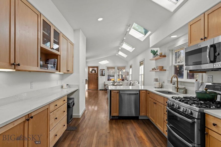 A timeless Southside Bozeman bungalow, thoughtfully reimagined for modern living, set directly across from the beloved Southside Park. This rare downtown residence pairs the architectural character of a 1940s home with contemporary updates and exceptional flexibility—just minutes from Montana State University and the heart of Bozeman. 

Spanning approximately 2,430 square feet, this thoughtfully updated home can live comfortably as a 4-bedroom + office, 2-bath single-family residence, or be utilized as a main-level home with a separate lower-level apartment. The main level features two bedrooms, a light-filled living room, kitchen, laundry, and a versatile office or dining space—highlighted by vaulted ceilings, skylights, original hardwood floors, and refined finishes that honor the home’s era while embracing modern style.

The lower-level apartment offers a private exterior entrance and includes two bedrooms, a kitchen, bathroom, and living area—ideal for flexible living arrangements or additional income potential. This versatility sets the property apart in the downtown market.

Additional highlights include an attached one-car garage (a true rarity in this location), air conditioning for year-round comfort, elegant plaster details, abundant natural light, and thoughtful renovations throughout. Enjoy immediate access to Southside Park’s tennis courts, playground, winter ice skating, and the unbeatable access to downtown dining, shopping, and recreation. Offered fully furnished for turn-key use.

A distinctive downtown Bozeman home offering location, flexibility, and timeless appeal—this is Southside living at its best.