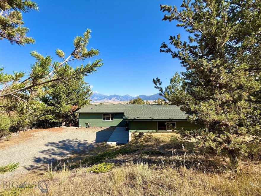 AFFORDABLE HOME IN PARADISE VALLEY! Situated on two acres near Emigrant, MT, this recently de-titled manufactured home offers country living in the heart of Paradise Valley. In addition to 3 bedrooms and 2 full baths, this lovely home has a spacious 320 sf living room addition with exceptional views, gas fireplace, dining room, master bedroom and bath. Outside is a massive 980 SF wood deck, attached double car garage lined with shelving, and a unique 'tiny tree house" at the end off the deck that could be used for yoga, an office, or a relaxing place to read a book, etc. Located just two miles from US Highway 89 South and nearby Emigrant for dining, groceries and fuel, banking and a post office. Property is about 10 minutes to the world-renowned Yellowstone River, 30 minutes to Yellowstone National Park, 30 minutes to Livingston and less than an hour to Bozeman and the Bozeman Yellowstone International Airport.