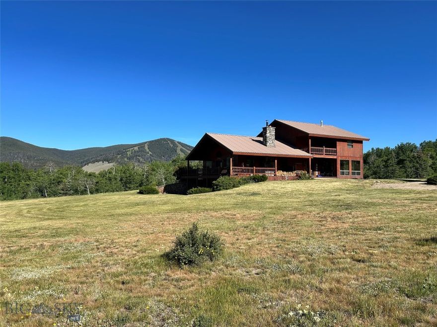 Located in the Grasshopper Valley which is highly regarded as Montana's best kept secret and surrounded by public lands; mean the only thing more beautiful than this 12.34 +/- acre property are the breathtaking views surrounding it.  Endless adventure and outdoor recreation are around every corner.  Hit the slopes on Maverick Mountain, snowmobile the same trails and chutes as a snowmobiling legend, soak in Elkhorn Hotsprings,  hike hundreds of miles of trails to dozens of mountain lakes or chase that trophy bull elk you find yourself daydreaming about on a general tag all from the comfort of this pristine mountain retreat.  The property is graced by a beautiful home that has been well maintained throughout the years.  The main floor features a tiled entry, laundry room and kitchen.  An open floor plan of the main level make it the perfect sport to entertain guests and family alike.  Vaulted ceilings offer plenty of space for those trophy mounts or precious works of art.  The master bedroom/bathroom, hot tub room, and a half bathroom round out the main level.  The second level features a bathroom, study, two bedrooms and a spectacular covered deck.  The finished basement is complete with a wet bar/kitchenette,  large family room, mechanical room, walkout patio and two bonus rooms that are currently being used as nonconforming bedrooms. A fire place on the main level and a wood stove in the basement are the perfect places to warm the body and soul after a long day of outdoor recreation.  A covered wrap around porch is just what the doctor ordered when watching majestic Montana sunsets and is the perfect place to unwind and allow the gentle breeze to carry away the burdens of daily life.  A 30x40 shop graces the property and is needed to store all of those must have toys and tools that are required for an outdoor lifestyle.  Mature landscaping, a dream location and all of the clean mountain air truly moves this property into the "forever home" category.  The only thing missing is you and a lifetime of memories to be made and cherished for generations!
