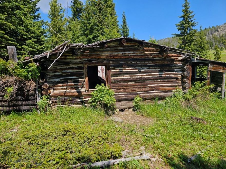 11.8 Acres of Montana land with a creek in the middle of the National Forest in the Elkhorn Mountains with a cabin site, an old relic miner’s cabin, elk and deer hunting, camping, ATVing, and more. It’s extremely rare to find land like this way out in the National Forest in the Elkhorn Mountains, and one that has Indian Creek running through it. There’s a leveled site so you can pull your camper in and start enjoying the creek and the views immediately while you make plans to build that cabin in the mountains you’ve always wanted.  Make sure you build it with lots of windows and face them so you’re overlooking Indian Creek and just across the creek, where the old relic miner’s cabin sits. If only the cabin could tell stories of back in the day when precious metals were the attraction in the area. And be sure to build a big deck on your cabin so you can sit out and listen to the babbling of the creek while the elk bugle in the fall and watch the sunsets over the Rocky Mountains. There’s already a leveled site to build, so it’s ready to start planning and building your new Montana mountain cabin whenever you are. Or bring up that wall tent or camper and have that place on the Elkhorn Mountains of your very own that you and your family can enjoy and pass down through the generations. What a feeling to know you’ve always got a place in the mountains to go get away, relax, and get back to nature, that’s all yours. This property sits way out in the National Forest, where you can go in any direction and hunt, hike, and enjoy the tens of thousands of acres of National Forest all around you. It’s like you’re buying a whole lot more land with all this extra easily accessible National Forest right out your front door that’s yours to enjoy as well, any time you take a notion. There are trails to hike, roads to drive or ATV, elk and deer to hunt, mountains to be climbed, and places to be explored, and it’s all close by within minutes of your new property in the mountains. It’s such an amazing bonus to have all this extra National Forest land right at your fingertips; you just can’t go wrong. The Elkhorn Mountains are renowned in Montana for their elk. They are plentiful, and the bulls grow big here in the Elkhorns, which is why the limited bull elk hunting tags are so coveted. This is a special hunting district in Montana that’s designed specifically to grow mature bull elk.