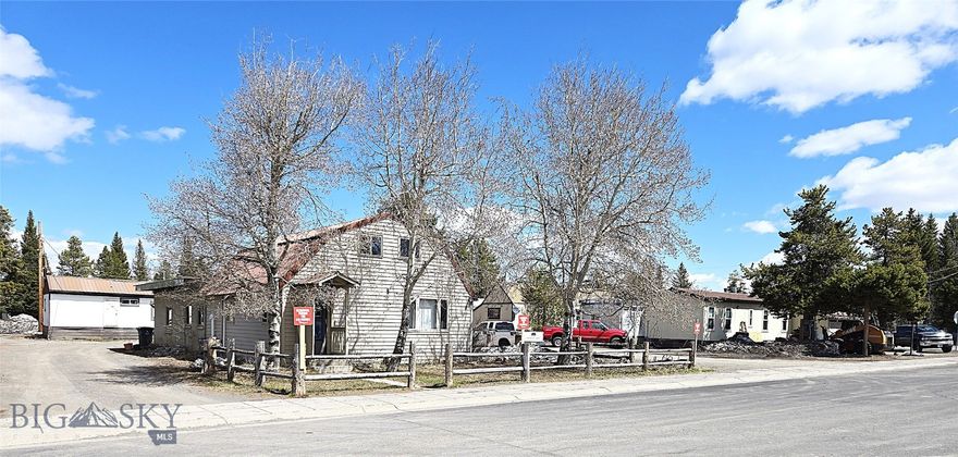 Unique opportunity in West Yellowstone to acquire a double city lot, Zoned B-3. This property offers a variety of possibilities, from employee housing to commercial uses, including warehouse, retail, or nightly lodging. The property is ideal for various uses and offers immediate returns with income generated from two rental units and five trailer pads.
