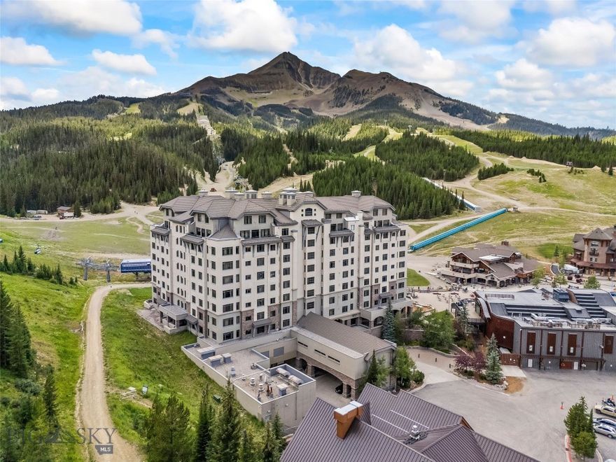 Own a piece of the premier 4-star Summit Hotel in Big Sky’s iconic Mountain Village. This spacious 6th floor,  1-bedroom lock-off unit is the only Spanish Peaks facing unit on the market in the Summit! This gorgeous, recently updated condominium offers one of the quietest locations in the Summit Hotel. Enjoy flexibility and comfort with two interconnecting rooms featuring two queen beds in the main bedroom, along with a wet bar and a bath, and a Murphy bed and fold-out sofa in the adjoining suite, which also offers a kitchen, dining area, fireplace, and another bathroom. Ideal for both personal use and rental income, this unit sleeps up to 8 guests comfortably. The interconnecting rooms offer a unique benefit over other condominiums in Big Sky in that owners have the option to use one of their rooms while keeping the other room in the rental pool, thus an owner can still collect income while staying in their unit.  This unit has consistently been a high-income earning property, please ask your agent for the rental history! Enjoy the best, and one of Big Sky's only "all season" ski-in/ski-out properties just steps from the slopes. Relax après-ski in the newly renovated pool and spa area, featuring a Himalayan salt sauna, heated indoor/outdoor pool, large fitness center, and outdoor hot tub with mountain views. With full hotel amenities, concierge services, valet, underground parking, large owner storage area, and fine dining on-site, you will experience the ultimate in alpine luxury.