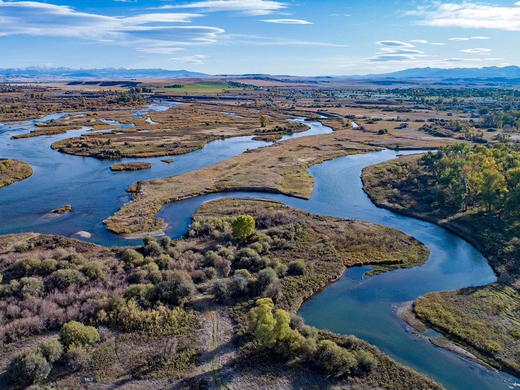 A sportsman's paradise, the Madison Bend Ranch, boasts fantastic fishing and hunting. This premier recreational property has direct access to the Madison River, multiple springs, sloughs, and high-quality river bottom land. The 222± acre habitat provides substantial food, water, and cover enhanced by cultivation for upland birds, waterfowl, and whitetail deer. Over 2± miles of combined Madison River main channel and Jefferson River braids offer deep, slow holes for large trout and more dynamic fishing and spawning habitat. A Morton structure gives a heated lounge and storage for recreational toys. With limited river float traffic and public access, Madison Bend Ranch offers a rare opportunity to own a private section of a premier river with outstanding riparian resources within close proximity to Bozeman.