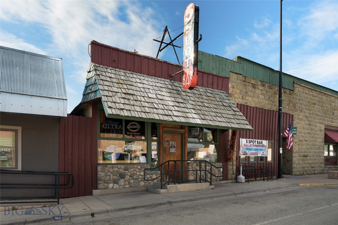 The iconic 5 Spot Bar and Casino, along with the Touch of Country Restaurant has been a staple in Absarokee, MT for years. Log walls surrounding the extensive wooden bar and stone fireplace make for a cozy local watering hole for all seasons. Centrally located on a corner downtown lot, this business has been successfully operated by locals for all to enjoy. The open seating atmosphere provides plenty of space for customers, complete with an outdoor patio and a private pool room leading into the Casino next door. The Casino consists of 18 slot machines and offers a variety of gaming. On the corner of the building sits the Touch of Country Restaurant, fully stocked with all fixtures and equipment needed to run a successful venture. Situated between the Interstate access, Nye, Fishtail and Red Lodge - the 5 Spot caters to travelers, miners, adventurists, outdoorsmen and locals alike.