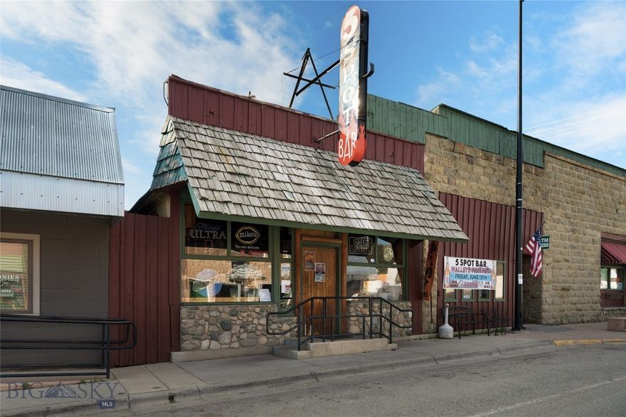 The iconic 5 Spot Bar and Casino, along with the Touch of Country Restaurant has been a staple in Absarokee, MT for years. Log walls surrounding the extensive wooden bar and stone fireplace make for a cozy local watering hole for all seasons. Centrally located on a corner downtown lot, this business has been successfully operated by locals for all to enjoy. The open seating atmosphere provides plenty of space for customers, complete with an outdoor patio and a private pool room leading into the Casino next door. The Casino consists of 18 slot machines and offers a variety of gaming. On the corner of the building sits the Touch of Country Restaurant, fully stocked with all fixtures and equipment needed to run a successful venture. Situated between the Interstate access, Nye, Fishtail and Red Lodge - the 5 Spot caters to travelers, miners, adventurists, outdoorsmen and locals alike.