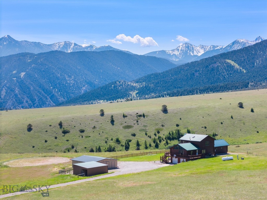 Stunning Property with Panoramic Views 10 Minutes from Downtown Livingston. Are you looking for a peaceful countryside retreat? Get ready to fall in love with 29 Wineglass Loop! Discover rural charm and modern amenities with this rare 20-acre property, ideal for horse enthusiasts. This special property offers breathtaking views and cozy living in a prime location close to downtown Livingston. Enjoy panoramic views of Park County, Absaroka and Crazy Mountains from every angle. This home features not one but two spacious master suites, each with its own private bathroom. The open floor plan interior is filled with natural light from the floor to ceiling windows, creating a bright and airy atmosphere. Step outside onto the expansive wrap around deck perfect for gatherings, morning coffee or simply taking in the views. From the deck you can look down on your 4-legged friends who are at home in the 4-stall barn which is steps away from the walk out basement. Don’t miss the opportunity to make this extraordinary home yours!