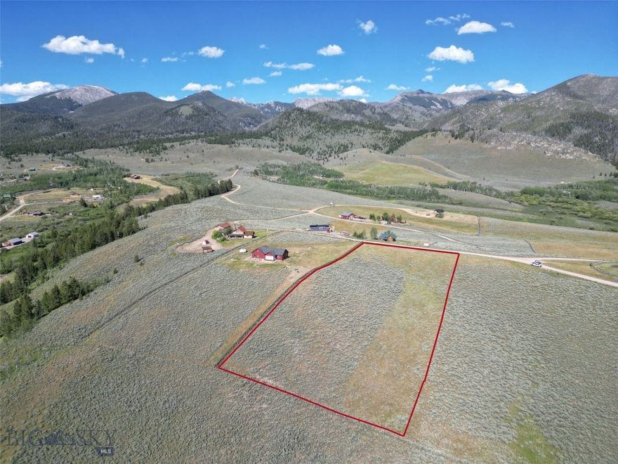 Looking for a quiet, rural property to build your Montana cabin - one that is close to skiing, hot springs, beautiful mountain views, and miles and miles of public lands? Here is a 3.214 acre lot in the small mountain town of Polaris, that has all of this, along with an existing well and fiber optics so you can work from home. Polaris is home to the Maverick Mountain Ski Area and the Elk Horn Hot Springs. This lot is located in the Comet Estates Subdivision and has excellent access off of the Pioneer Mountain Scenic Byway. This is an area of outstanding recreation opportunities, including downhill and cross-country skiing, snowmobiling, hiking, hunting, fishing and more. Public lands are just a short drive from the lot and includes state and USFS lands. The forests have excellent populations of elk, moose, deer, and even some mountain goat. The high elevation lakes and creeks contain numerous species of trout. The high lakes also can include arctic grayling. The trail to Sawtooth Lake is close to this property, along with other Forest Service trails. The town of Polaris is about 40 miles from Dillon, which has all your necessary amenities - hospital, grocery stores, university, private airport and more. The closest full size airport is found in Idaho Falls - 2 hours south. If this is the type of property you are looking for, call for a showing today!