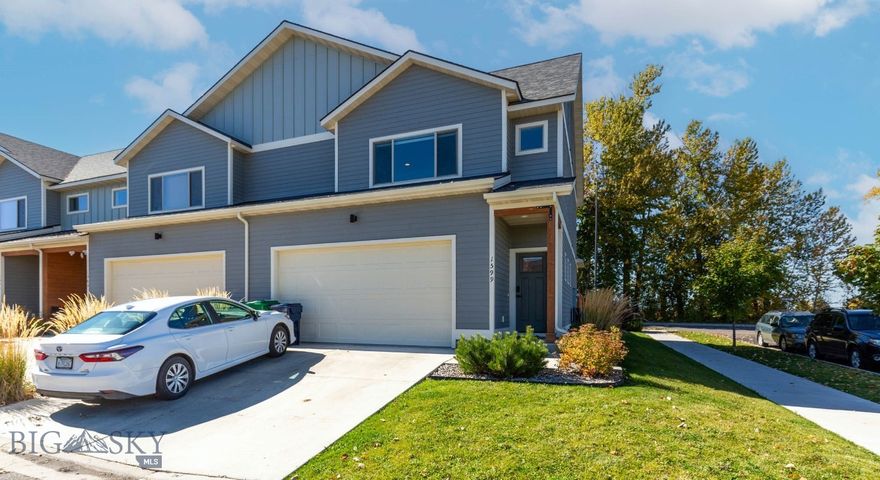 If you’ve been searching for a townhouse with a big fenced yard, this is the one! This end-unit sits on a roomy corner lot with extra side yard space and a spacious fenced back yard — perfect for pets, play, or gardening. Inside are 3 bedrooms, 2.5 baths, and over 1,600 sq. ft. of upgraded comfort, featuring hardwood floors, central A/C, solid wood doors, and tile floors in the bathrooms. The open floor plan and central kitchen are perfect for get togethers with an island for gathering, granite counters, gas range, soft-close cabinets, and ultra quiet dishwasher. Enjoy beautiful views of the Bridgers from the primary suite with private bath. There's also a 2 car attached garage for all your toys. Great location across from the Gallatin Regional Park & dinosaur playground, and close to schools and shopping.  Call for your private tour today!