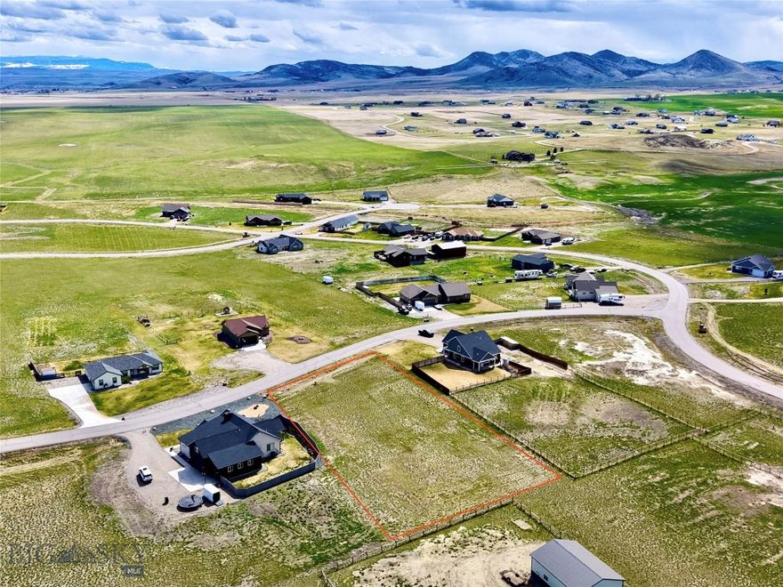 Lot 173 Western Larch Place is a level, build-ready 1.04-acre home site in The Village at Elk Ridge, a well-established subdivision eight miles from Three Forks, Montana. Power is already to the lot, legal access is in place via paved subdivision roads, and the groundwork of a quality community — covenants, maintained infrastructure, and shared amenities — is already in place. For a buyer with plans in hand, there is very little standing between this parcel and a shovel in the ground. The setting is the real story. From this lot, the horizon opens across the Gallatin Valley floor to four surrounding mountain ranges, with light and color shifting through every season. The subdivision itself is thoughtfully laid out with more than 25 acres of shared open space, a 6-acre park, a gazebo, barbecue areas, and basketball courts. Location is where the numbers work. The lot sits at the center of a triangle formed by three of Montana's most active markets: roughly 30 minutes to Bozeman, an hour to Helena, and just over an hour to Butte. Interstate 90 is minutes away. Yellowstone National Park is 90 minutes south; Bridger Bowl, the Madison, the Gallatin, and the Jefferson rivers are all within an easy drive. Three Forks itself, the historic site of the Missouri Headwaters and a small town with real staying power, offers day-to-day services, a 9-hole golf course, and steady growth tied to the broader Gallatin Valley corridor. For a buyer ready to build their Montana home, this is a straightforward lot at an accessible entry price in a region where lots like this have become increasingly hard to find under six figures. For an investor, it is a low-carry hold in a path-of-growth market anchored by Bozeman, one of the fastest-growing small metros in the country. The seller is motivated and open to a clean, reasonable offer.