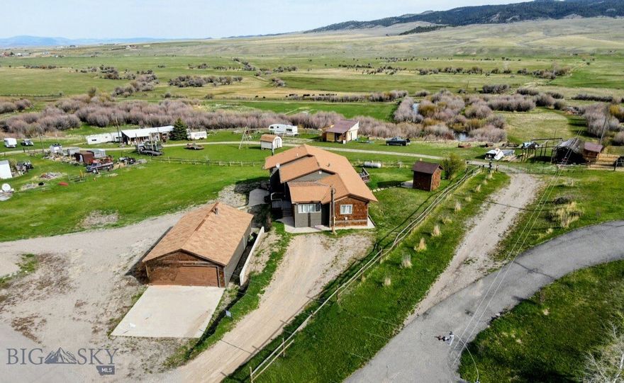 This rare find is on 1 +/- acre overlooking the Smith River Valley & surrounded by the Belt mountain ranges & the Park Hills. Outside the city limits, the home is on a private well & septic & has no covenants. The possibilities for use include a single family residence, multiple residences, an airbnb, a venue for gatherings, & more. There is plenty of space for a large garden & animals. The endless outdoor recreational opportunities are year round. Currently, an airbnb, the home is being sold turnkey. The remodeled interior in 2018, this Broadmore mobile home is detitled and added onto with a partial basement and permanent foundation. The home has a primary bedroom with a bath, two bedrooms, 1 full bath, an open dining room & kitchen, & a bright living room. The walkout basement is finished with a woodstove, 4 full beds, & a couch. The home also has electric baseboard and propane forced air heat. There is a 2 car garage with a work space & woodstove.