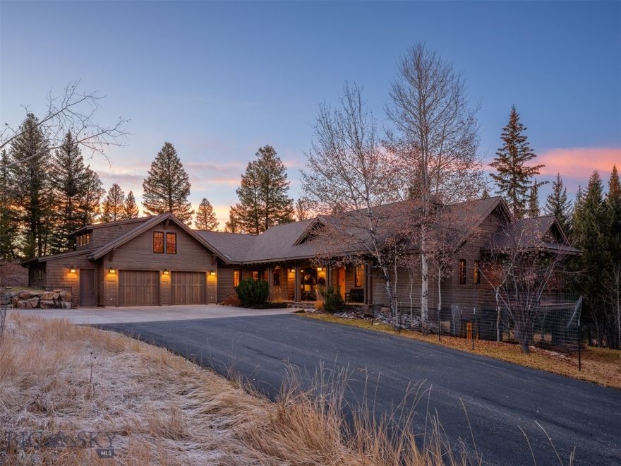 Experience the ultimate in Montana living at this private Big Sky retreat, a blend of quiet luxury and unmatched natural beauty. Set in a gated, year-round access community, this custom 4 bed, 5.5 bath home is sold turnkey/furnished and is set amidst 21+ acres of timberlands with views towards Lone Mountain. The property feels a world away but is only minutes to the shopping, restaurants, medical, golf, trails and amenities in Big Sky Town Center/Meadow Village. Timeless mountain architecture and fantastic curb appeal welcome you in – the beauty of the home unfolds as you enter across the stone covered porch and into the spacious great room with rich solid wood flooring, vaulted T&G ceilings and timber-frame beam work. The living room is anchored by an impressive rock surround wood burning fireplace – perfect for enjoying the crackling warmth of a real wood fire on a cold winter’s day. A vaulted wall of glass opens towards the forest and surrounding mountains, ushering the outside in. The home’s expansive windows capture abundant natural light and views of the forest, Lone Mountain and surrounding mountains. Enjoy frequent wildlife viewing as elk, deer, moose, fox, birds and other mountain animals call this land home. Formal dining and spacious chef’s kitchen featuring custom wood cabinetry and dining bar, six burner range top and professional hood, solid surface counters and plentiful storage. An all-season sun porch with cozy rock surround fireplace and grill with hood is the perfect spot for morning coffee. Enjoy the spacious stone patio and hot tub. The main floor primary suite features Its own covered outdoor porch and two primary suite bathrooms/walk in closets. The daylight walk-out downstairs features high ceilings and access to the lawn and lower-level patio, a large flex space/recreation-game room with gas fireplace, a gym, a sauna, two bedrooms and two baths. Above the 2-car oversized 1000+ sq ft heated garage with shop and dog wash sits additional living space - including an upper-level office, an additional bedroom suite with full bath and storage. This home features a fire suppression system and landscaping irrigation around the build site perimeter. Only minutes on paved and maintained roadway amenities, medical, trails, Big Sky Resort and Gallatin River. 1 hour to Bozeman Yellowstone International Airport. 1 hour to Yellowstone National Park. 1 hour to downtown Bozeman. Don’t miss the VR Matterport 360 interactive tour!