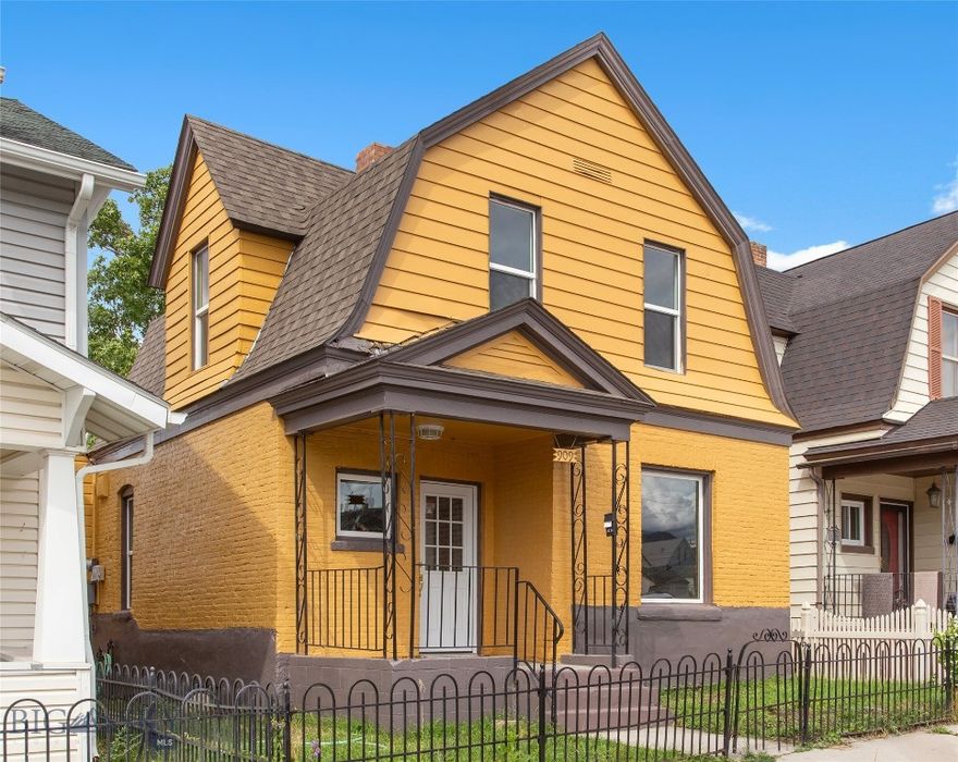 Charming three-bedroom home blending historic Butte character with modern updates. Bright and inviting with tall windows and refinished hardwood floors. The updated kitchen features dark cabinetry, granite-style counters, and a stylish tile backsplash. Upstairs offers cozy bedrooms with new carpet and mountain views. The bathroom includes a clawfoot tub and separate shower. Enjoy a fenced yard with a mature tree and two car garage. Major updates include a newer roof (2020) and upgraded plumbing, heating, and electrical (2023). Move-in ready and full of warmth. Schedule your showing today!