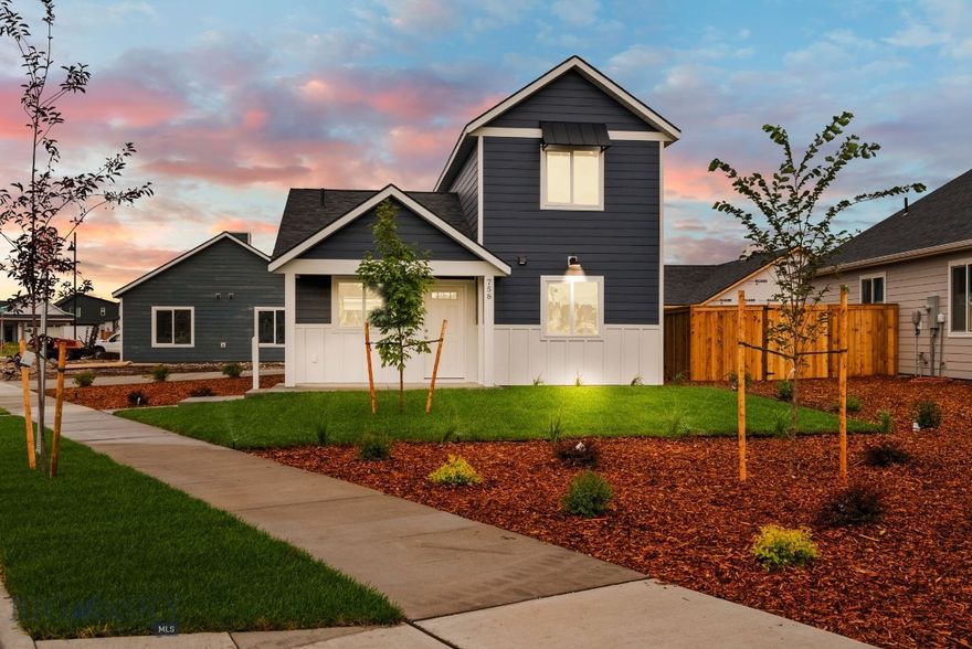 Nestled onto a unique corner lot in the heart of the new West Post subdivision, this brand new cottage from Williams Homes offers a charming alternative to traditional single-family living. This 2-bed 2-bath home is split across two primary bedrooms that come together in a cozy but open living room. On the first floor, you'll find the first primary with a detached bath across the hall, its walk-in closet winding all the way under the staircase. Linen and laundry closets create a hallway back out to the kitchen, where you'll find quartz counters highlighted by the perfect tile backsplash. Ample storage in the cabinets and under the island will keep your Instant Pot, blender, and other appliances out of the way. Stainless steel appliances are fully included, from the gas range to the French door fridge.

Heading upstairs, windows line the stairwell, creating a grand entrance to the vaulted primary bedroom. Views of the Bridger Mountain Range seamlessly pop through this room's windows, with the "M" trail and foothills lined right down the street, and the sunrise peeking through Ross Pass. The quartz counters, walk in closet, and glass shower blend the elegance of this room with the functionality that Williams is known for.

Located south of I-90 in Belgrade, West Post offers amazing access to Bozeman, Big Sky, the Bridgers, and the Madison River Valley. Home to playgrounds, a sprawling soccer field, pond, dog park, and picnic areas. Walking paths connect the residential areas to the community retail and grocery, keeping everything close to home.